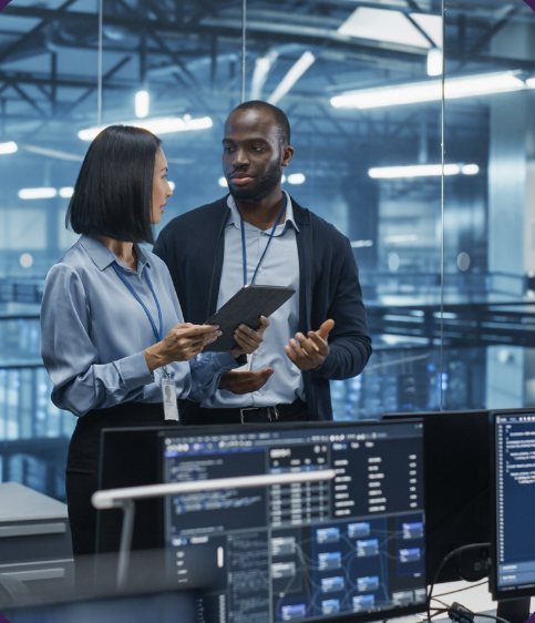 Two colleagues reviewing data in a modern office